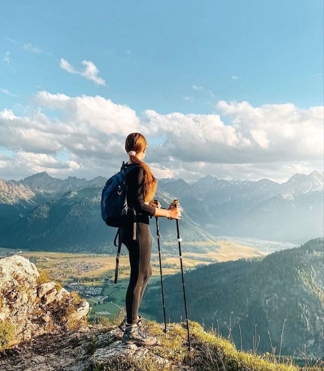 Two people riding ATV
